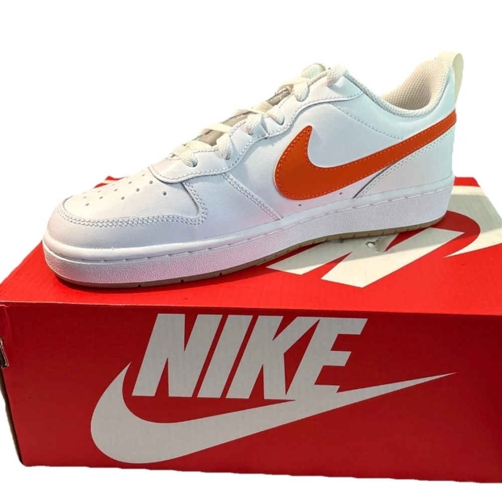 Big Kids Nike Court Borough Low 2 (GS) sneakers in a white and orange colorway.
